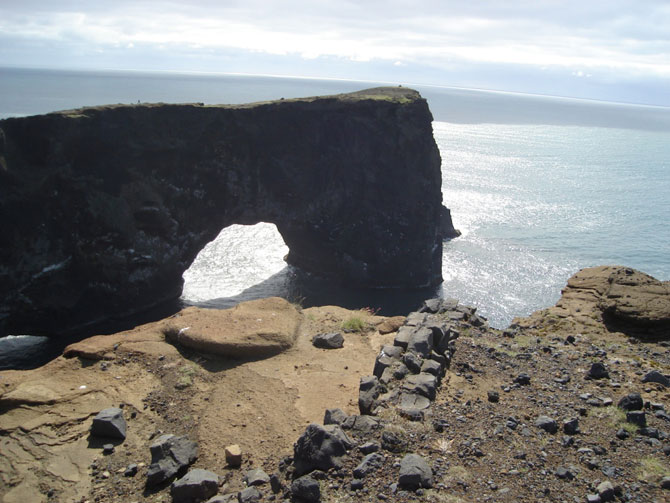 Arch of basalt rock at Dyrholaey, near Vik
